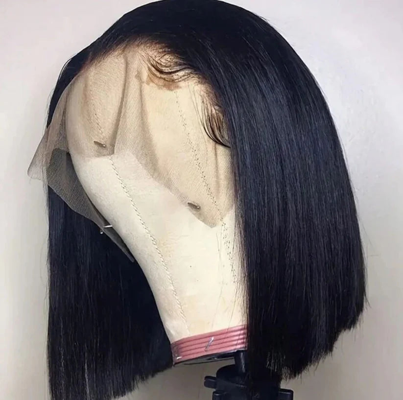 straight Black bob human hair wig on a mannequin head against a white background